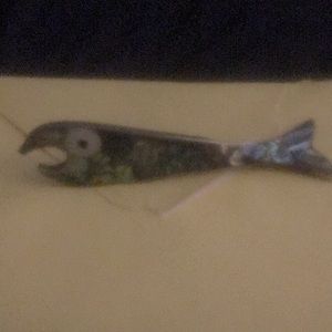 Very nice piece. Abalone shell and Mexican silver, fish shaped bottle opener.